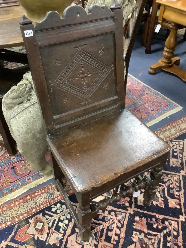 A 17th century oak back stool with lozenge carved decoration, width 48cm, depth 41cm, height 98cm